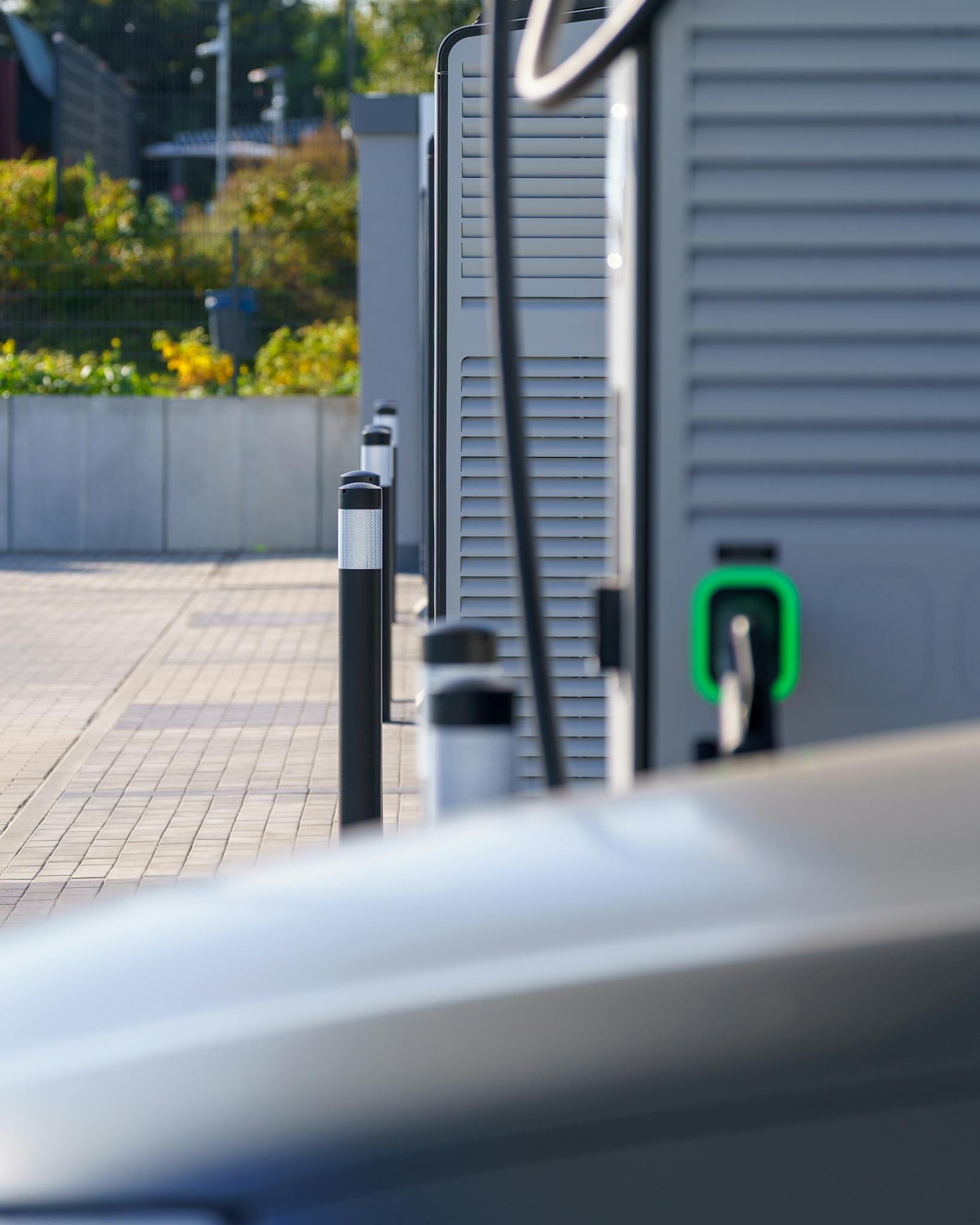 Modern electric vehicle charging station outdoors highlighting clean transport and sustainable energy.